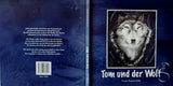 Cover Vorderseite und Cover Rückseite mit Titelbild von dem Buch " Tom und der Wolf " Das Buch ist blau mit Orginalfoto by Madella-Mella Ursula 